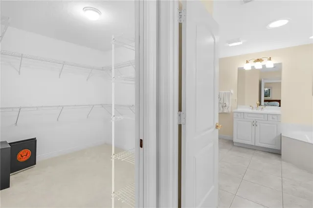 a view of a storage & utility room with closet dryer and washer