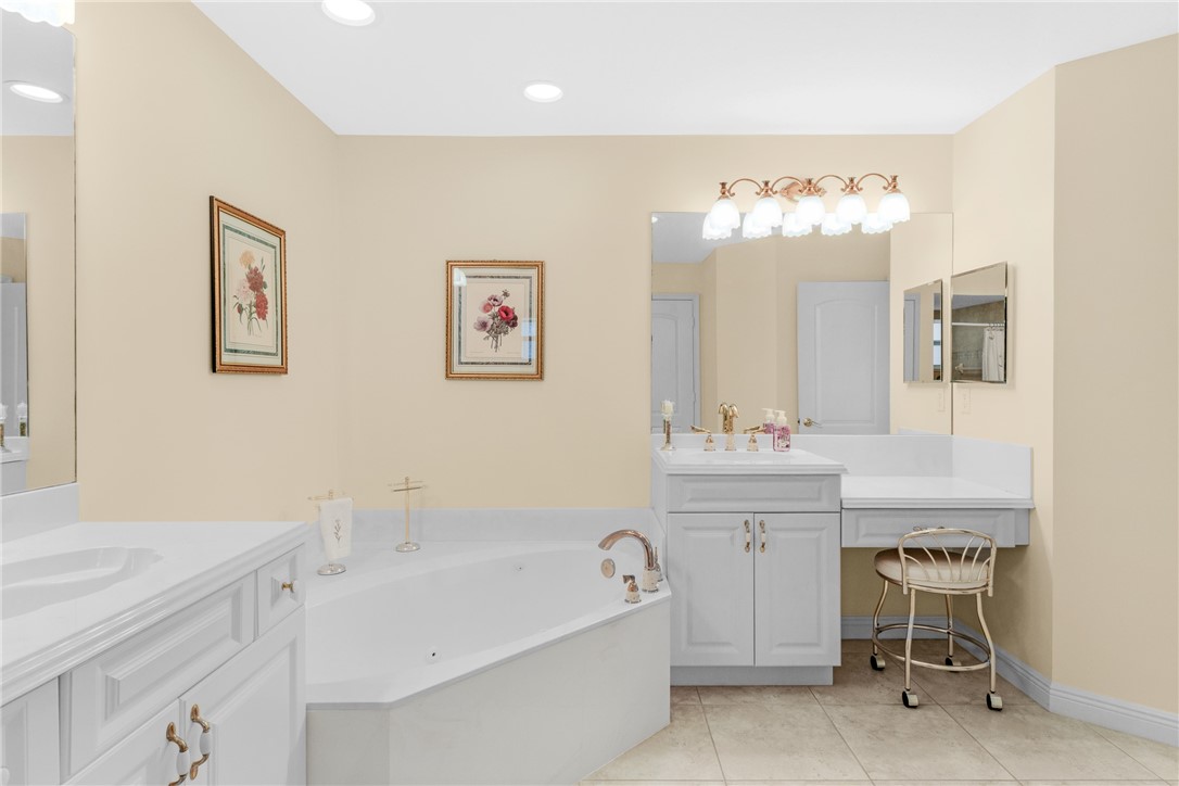 258 Main Street Sebastian, FL 32958 - Photo 18 of 32 a bath room with a sink and a mirror