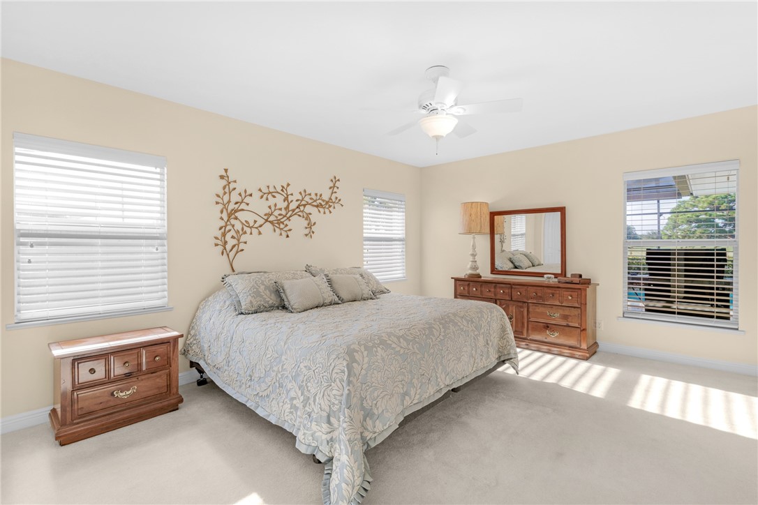 258 Main Street Sebastian, FL 32958 - Photo 19 of 32 a bedroom with a bed and a tv