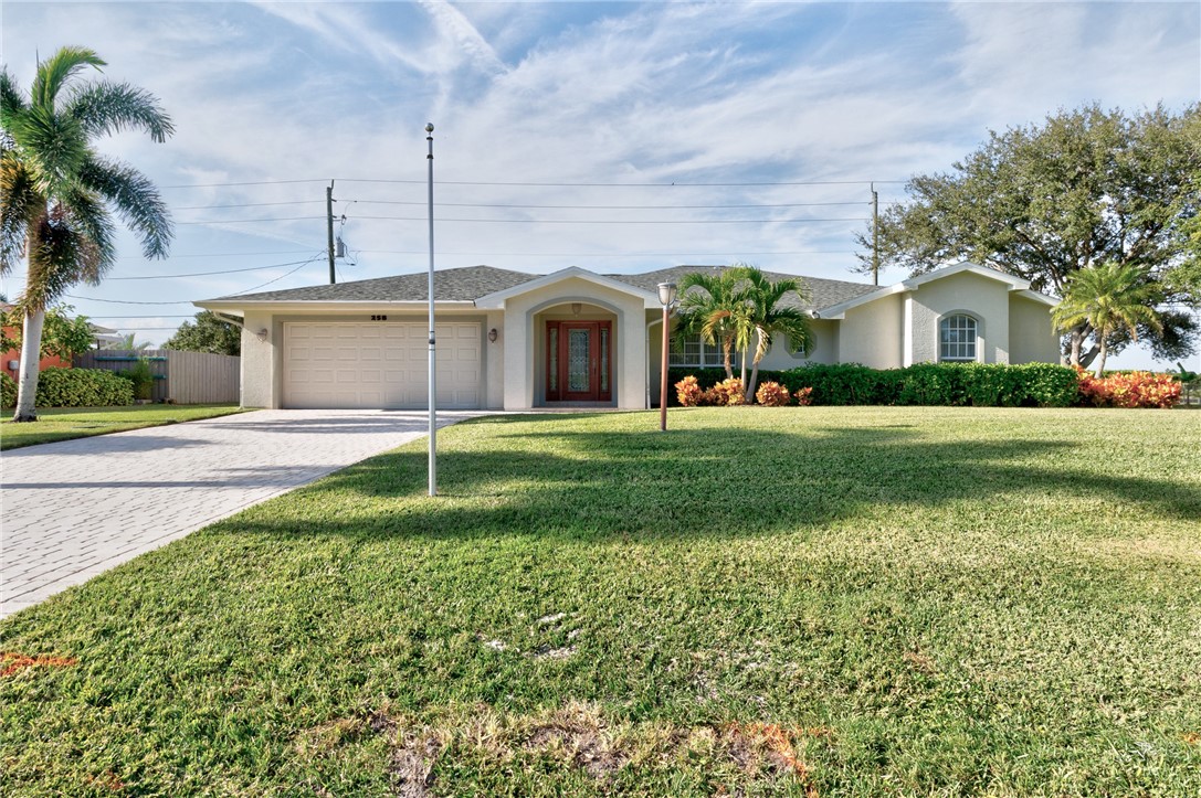 258 Main Street Sebastian, FL 32958 - Photo 2 of 32 a front view of house with yard and green space