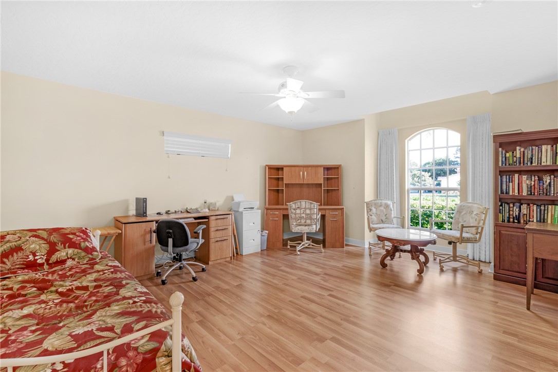 258 Main Street Sebastian, FL 32958 - Photo 22 of 32 a living room with furniture and a wooden floor