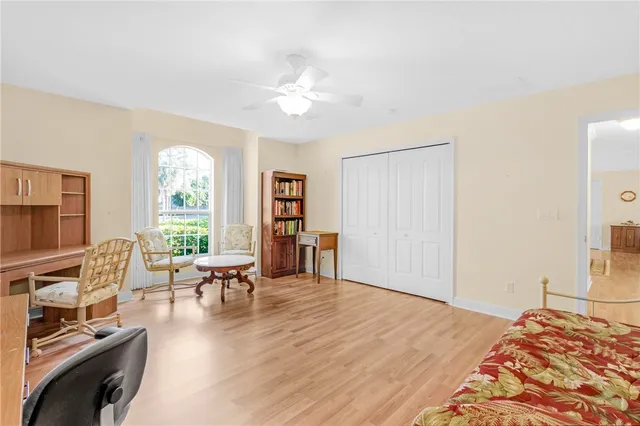 a bedroom with furniture and a window