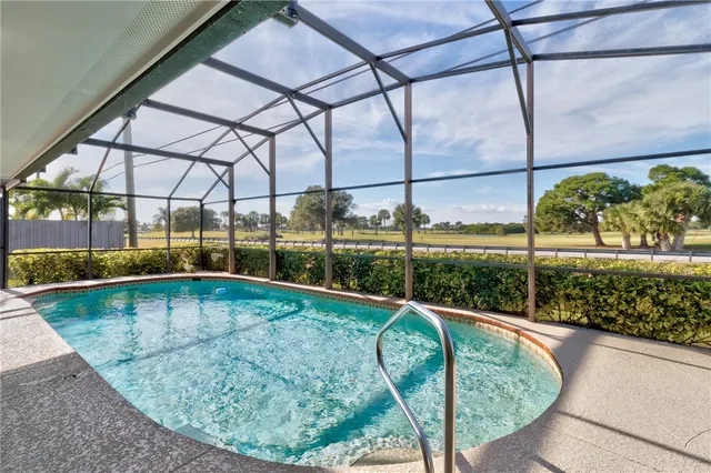 a view of a swimming pool with a porch