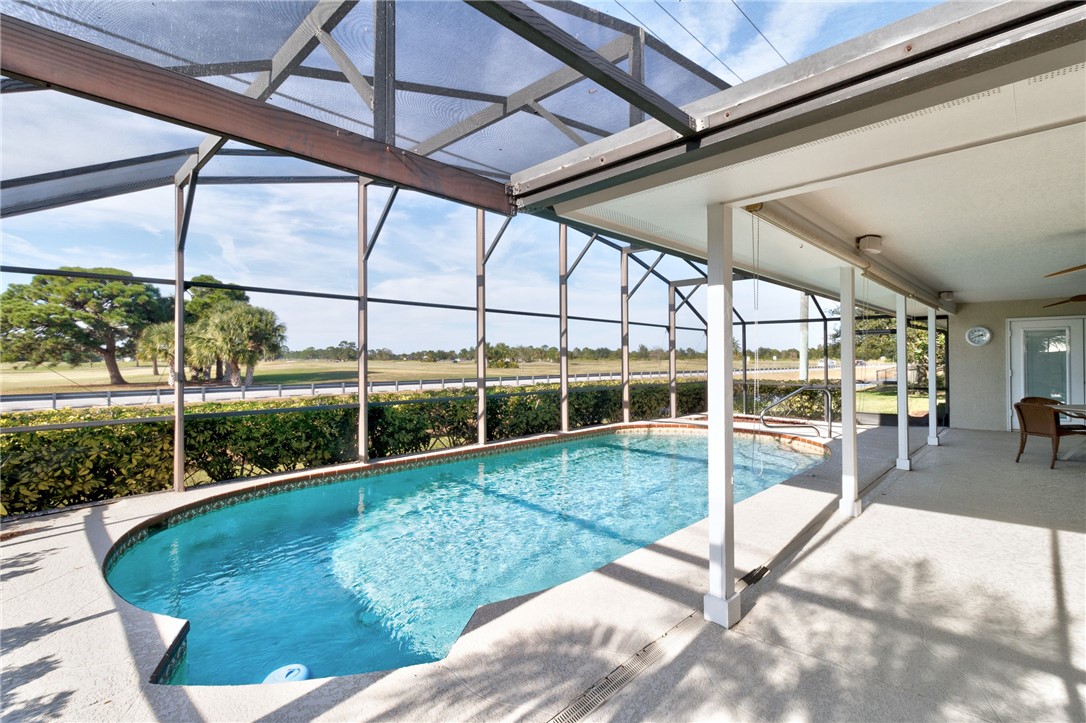 258 Main Street Sebastian, FL 32958 - Photo 27 of 32 a view of a swimming pool with a patio