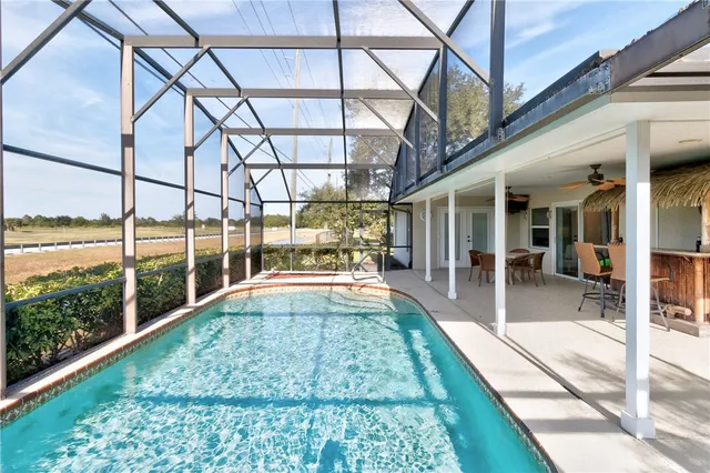 a view of a swimming pool with a patio
