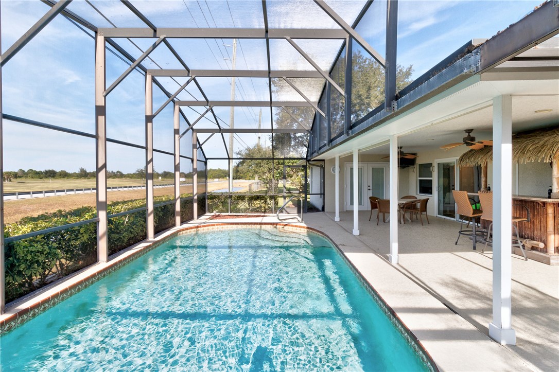 258 Main Street Sebastian, FL 32958 - Photo 28 of 32 a view of a swimming pool with a patio