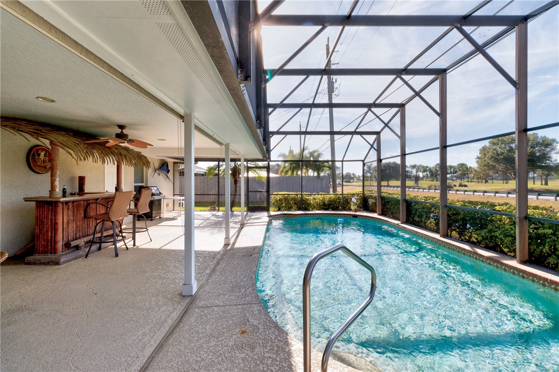 258 Main Street Sebastian, FL 32958 - Photo 30 of 32 a view of swimming pool with a patio and garden view