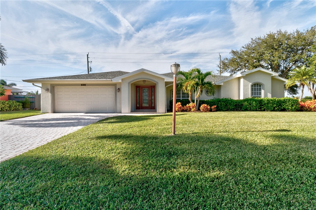 258 Main Street Sebastian, FL 32958 - Photo 3 of 32 a front view of house with yard and green space