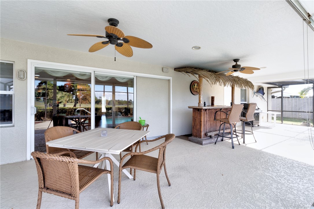 258 Main Street Sebastian, FL 32958 - Photo 31 of 32 a view of a dining room with furniture and chandelier