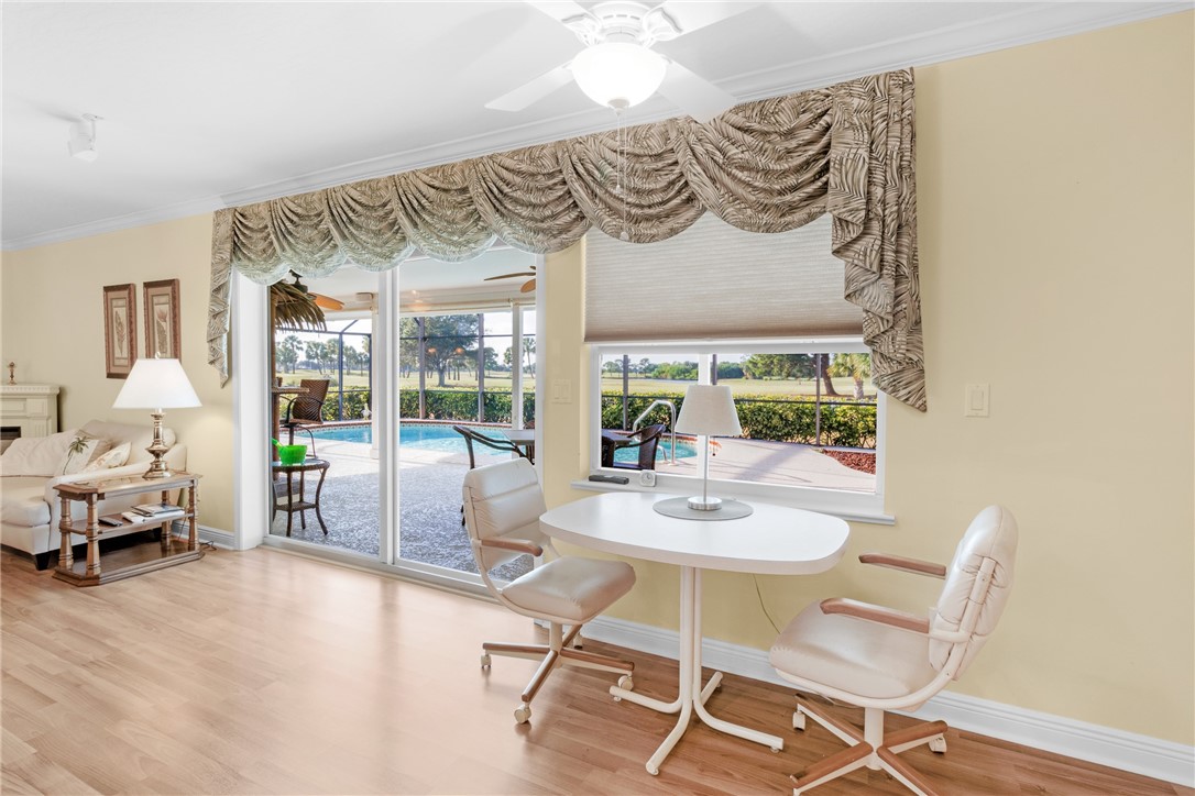 258 Main Street Sebastian, FL 32958 - Photo 8 of 32 a view of a dining room with furniture one side kitchen view and wooden floor