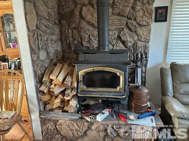 2391 Enterprise Road Reno, NV 89521 - Photo 9 of 15 a living room with a fireplace furniture and a rug