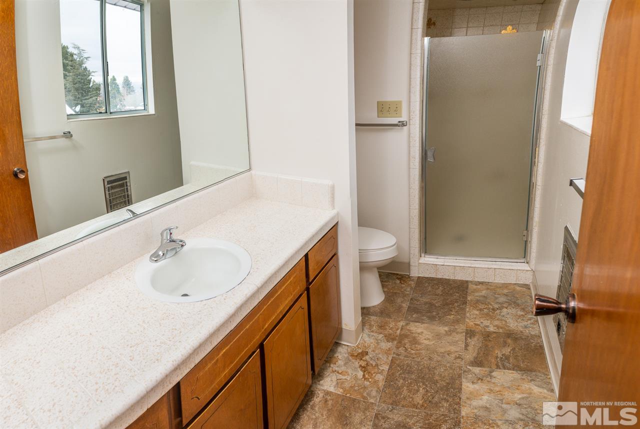 3255 Argo Way Reno, NV 89509 - Photo 15 of 25 a bathroom with a sink a toilet and a shower