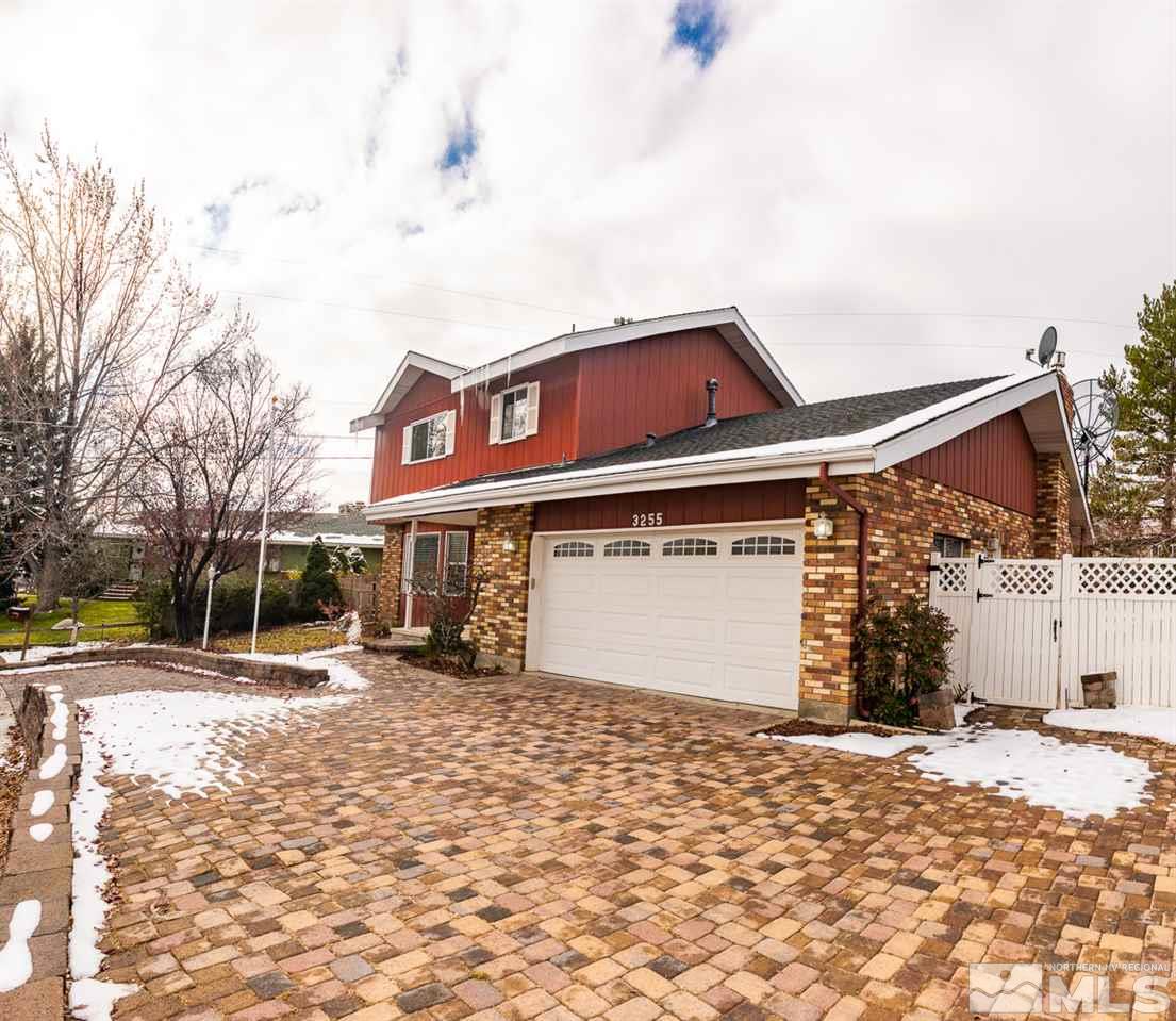 3255 Argo Way Reno, NV 89509 - Photo 2 of 25 a front view of a building with a yard