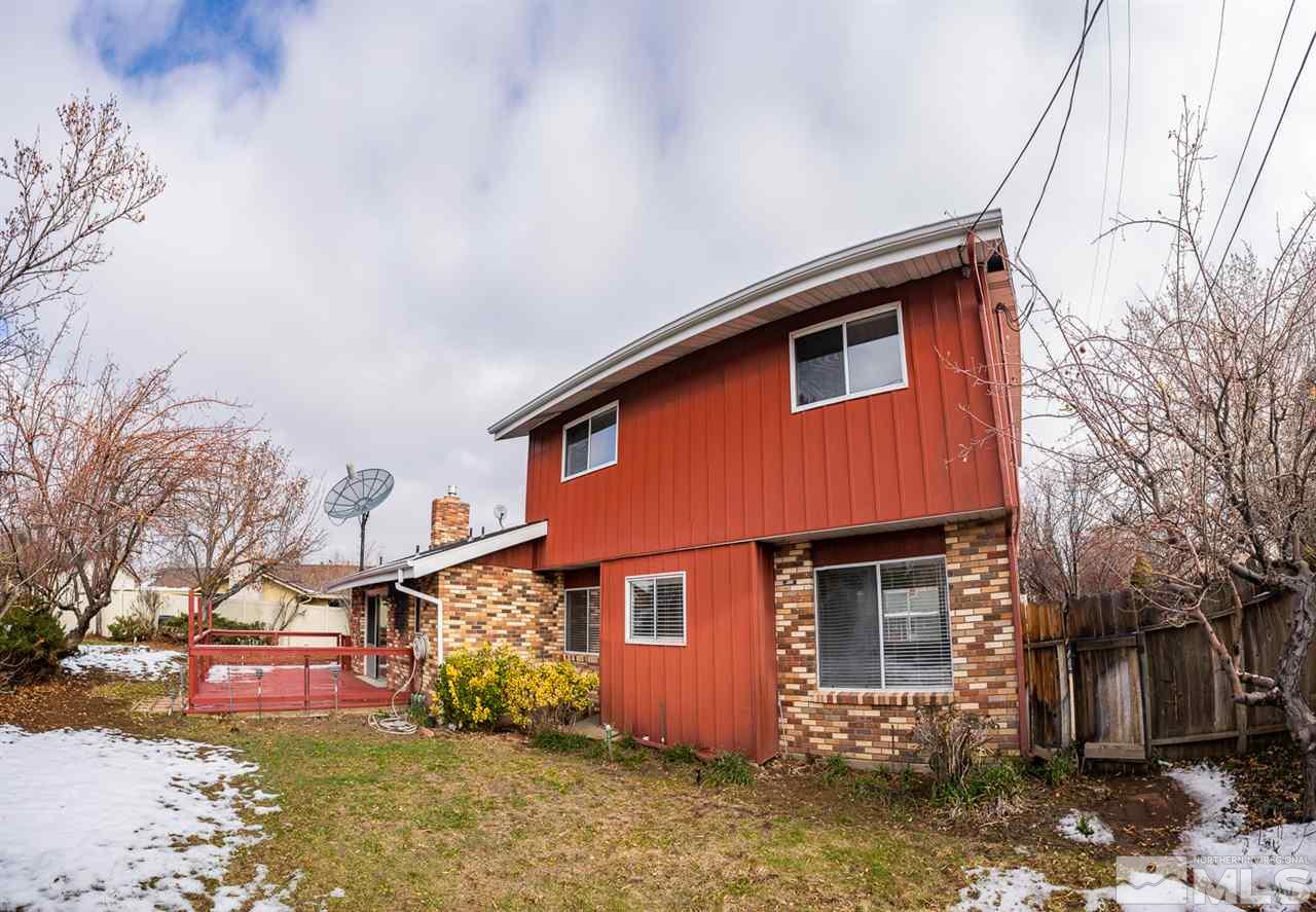 3255 Argo Way Reno, NV 89509 - Photo 23 of 25 a front view of a house with a yard