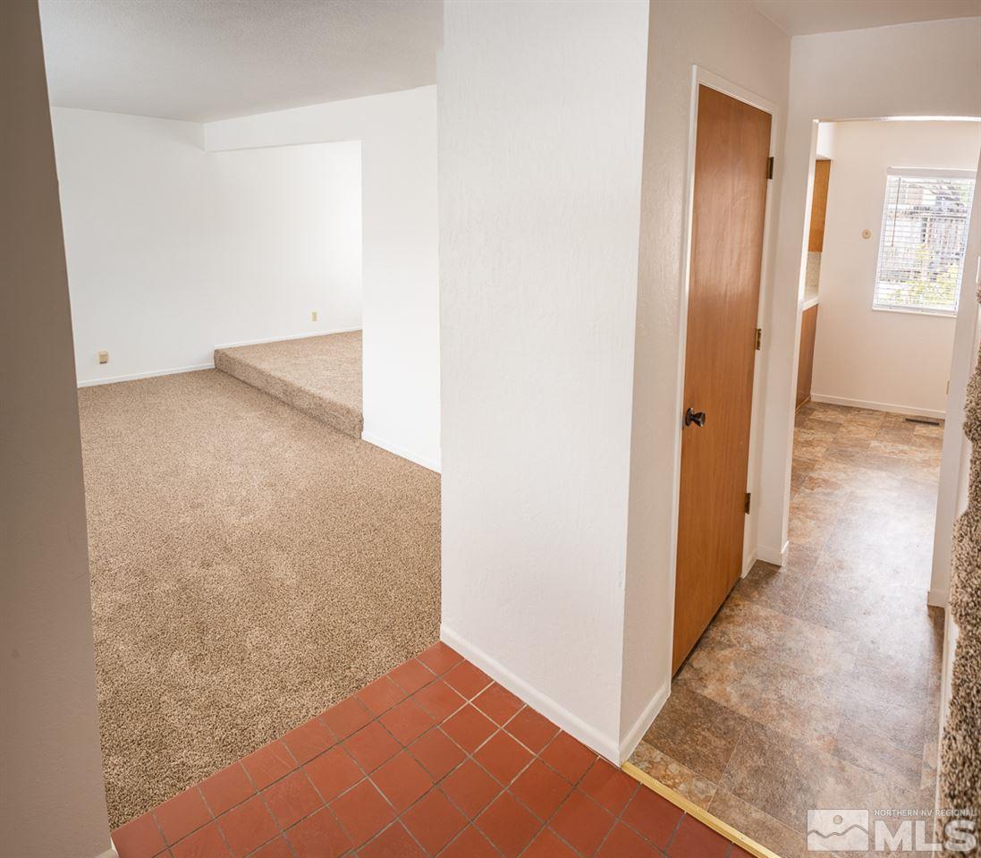 3255 Argo Way Reno, NV 89509 - Photo 7 of 25 a view of a hallway with wooden floor