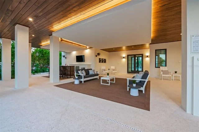 a front view of a house with a yard table and chairs