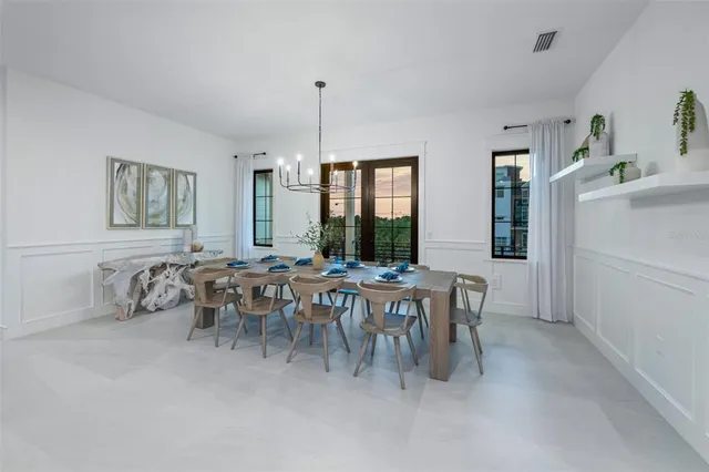 a large white bed in a hotel room and a balcony