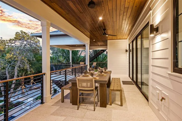 a view of balcony with couch and wooden fence