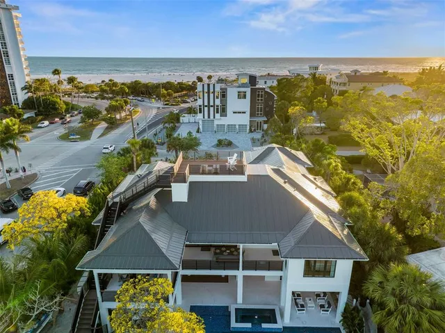 an aerial view of residential building with outdoor space and lake view