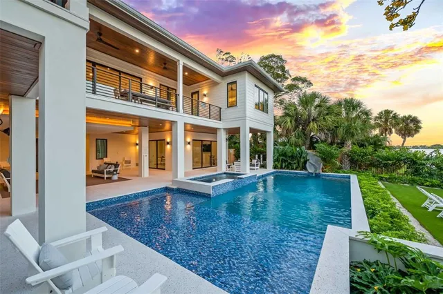 a view of a golf course with chairs