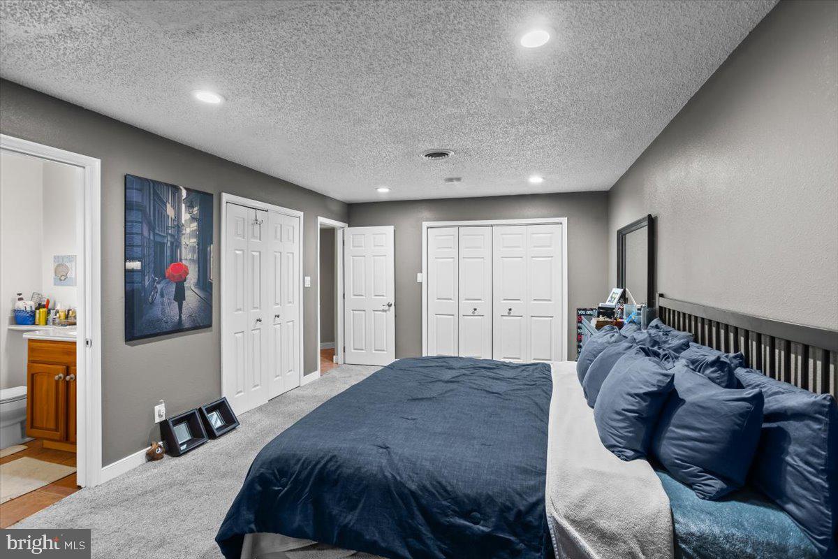 645 South 14th Avenue Lebanon, PA 17042 - Photo 18 of 67 a spacious bedroom with a bed and a walk in closet