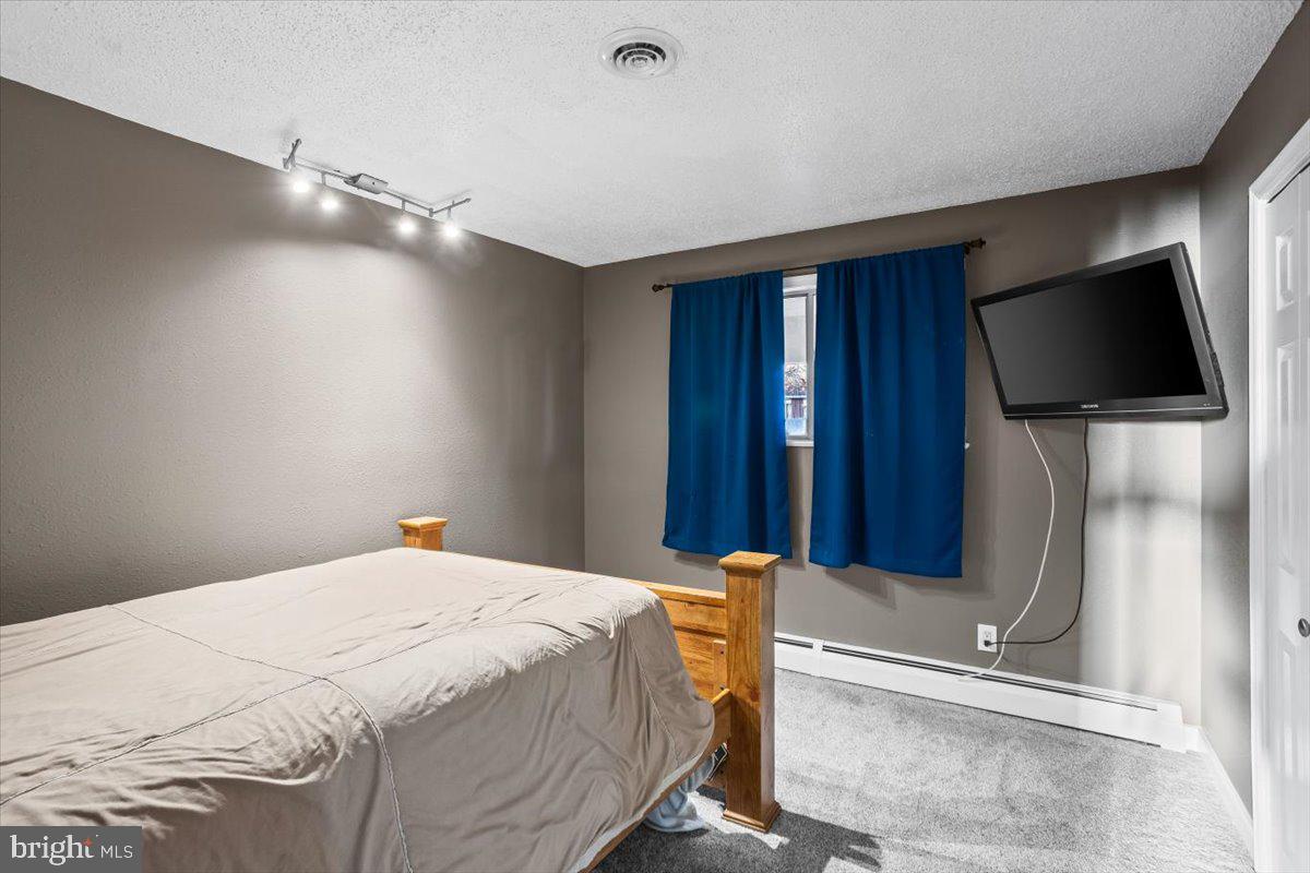 645 South 14th Avenue Lebanon, PA 17042 - Photo 20 of 67 a bedroom with a bed and a flat screen tv