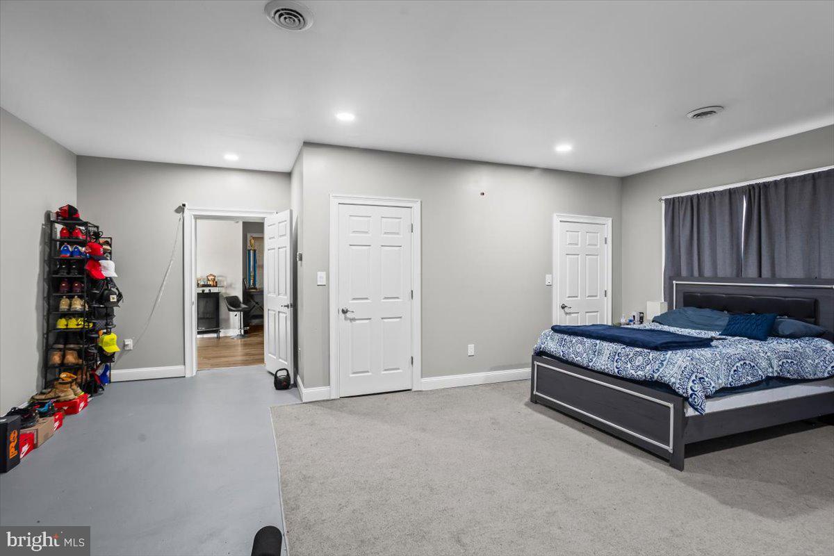 645 South 14th Avenue Lebanon, PA 17042 - Photo 33 of 67 a spacious bedroom with a bed and a chandelier