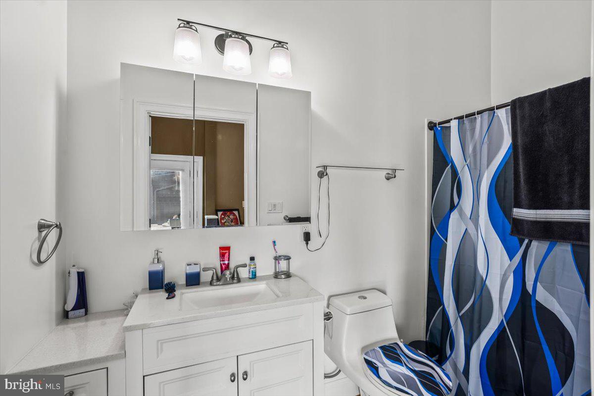 645 South 14th Avenue Lebanon, PA 17042 - Photo 34 of 67 a bathroom with a sink vanity mirror and toilet