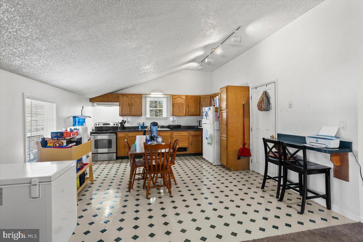 645 South 14th Avenue Lebanon, PA 17042 - Photo 50 of 67 a living room with furniture a dining table and chairs