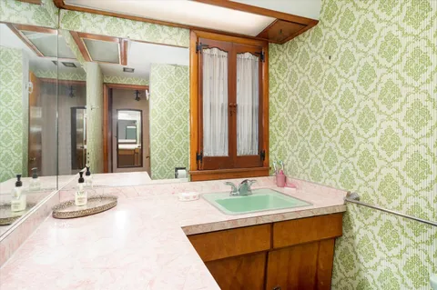 a bathroom with a sink and a mirror