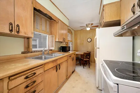 a kitchen with a sink and cabinets