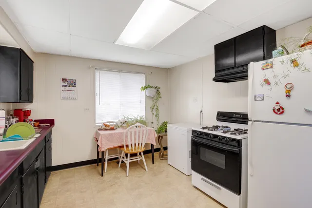 a kitchen that has a stove and a microwave