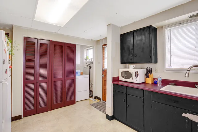 a kitchen with stainless steel appliances granite countertop wooden cabinets a sink and dishwasher