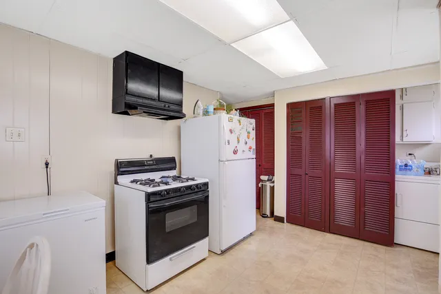 a kitchen with a stove and a microwave