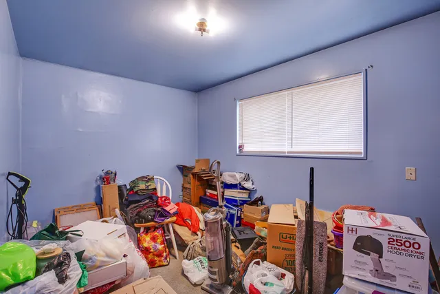 a room with furniture a chandelier and a window