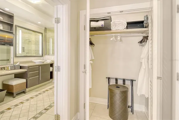 a view of a kitchen with a refrigerator and cabinets