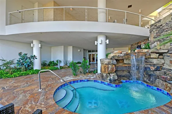 a view of a swimming pool with sitting area