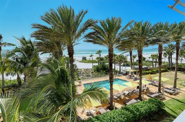 a view of a yard and swimming pool