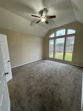 a spacious bathroom with a double vanity sink a large mirror and a bathtub