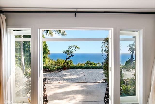 a view of a door and a window