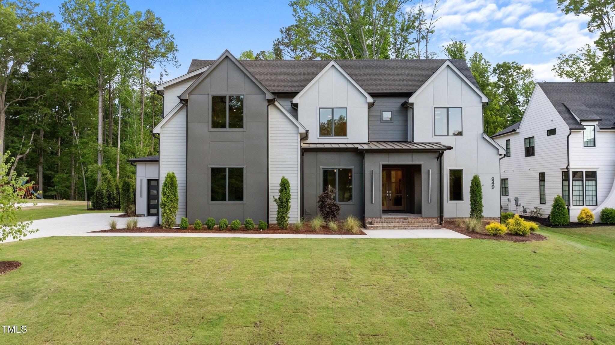 949 Harrison Ridge Road Wake Forest, NC 27587 - Photo 2 of 52 a view of a house with outdoor space and sitting area