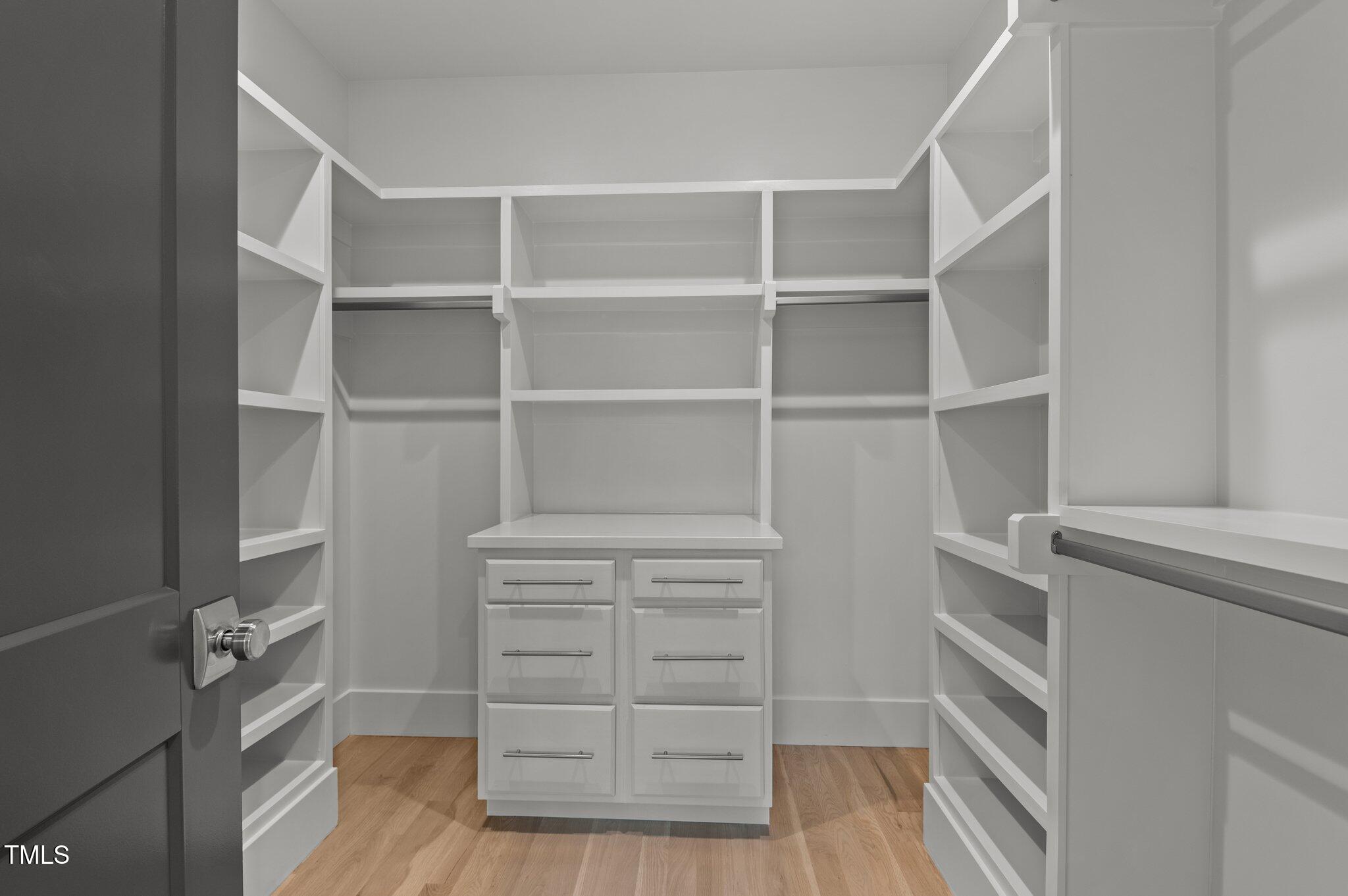949 Harrison Ridge Road Wake Forest, NC 27587 - Photo 35 of 52 a view of walk in closet with empty racks