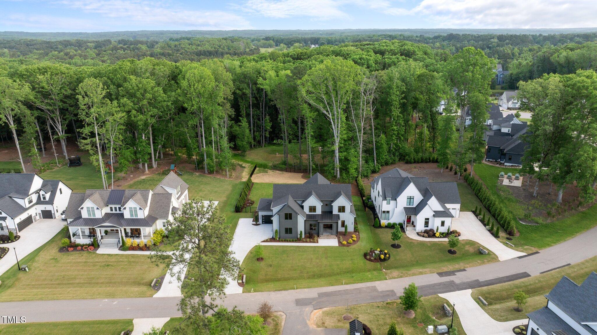 949 Harrison Ridge Road Wake Forest, NC 27587 - Photo 52 of 52 an aerial view of a house with lake view