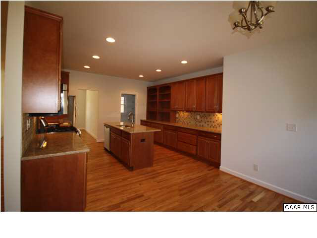 22 Valley View Road Ruckersville, VA 22968 - Photo 3 of 5 a kitchen with stainless steel appliances granite countertop a stove a sink and a refrigerator