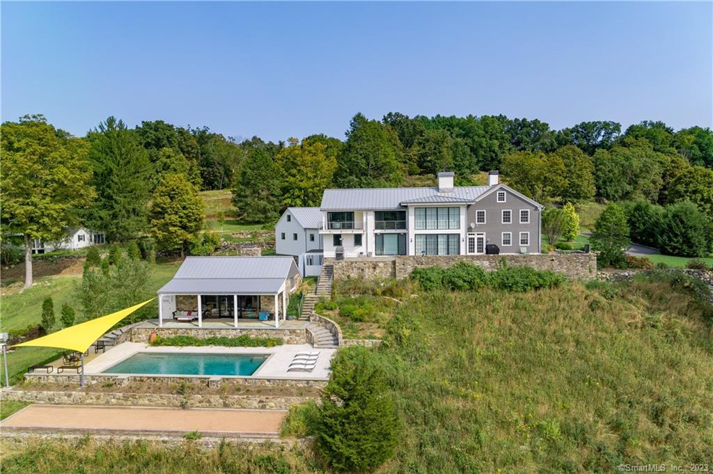 105 Seeley Road Wilton, CT 06897 - Photo 1 of 1 a front view of a house with a yard