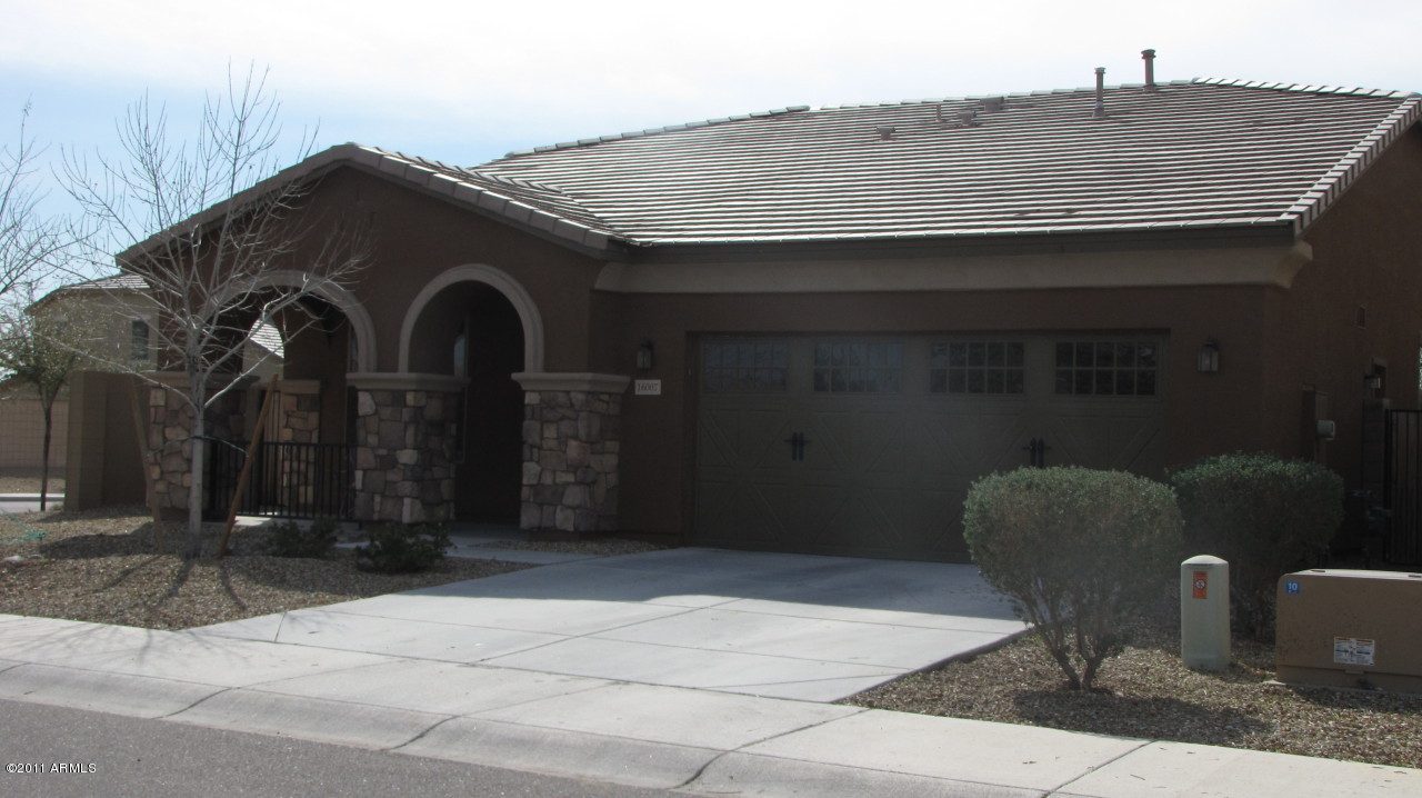 16007 West Pima Street Goodyear, AZ 85338 - Photo 1 of 35 a front view of a house