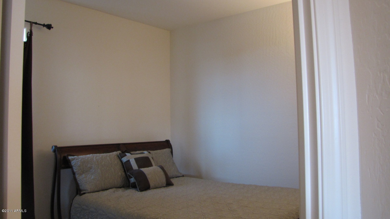 16007 West Pima Street Goodyear, AZ 85338 - Photo 14 of 35 a bed room with a bed
