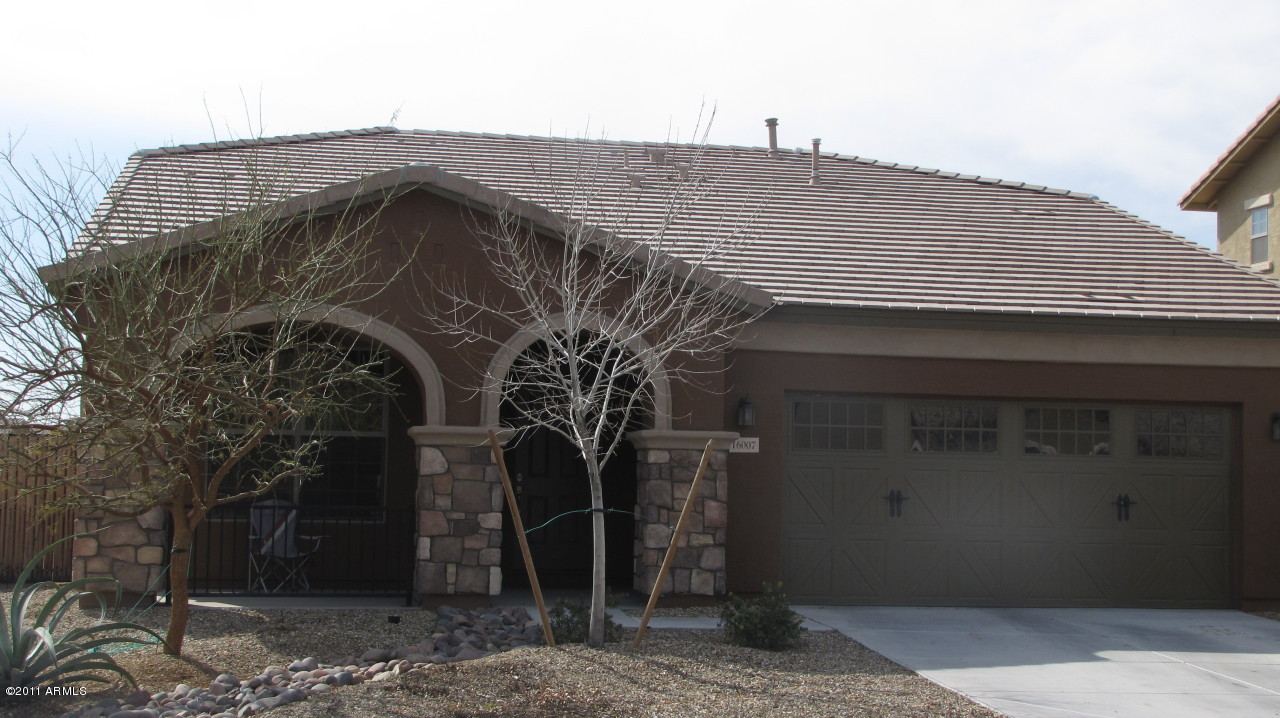 16007 West Pima Street Goodyear, AZ 85338 - Photo 2 of 35 a front view of a house