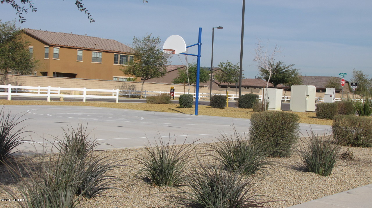 16007 West Pima Street Goodyear, AZ 85338 - Photo 30 of 35 a swimming pool with outdoor seating and yard