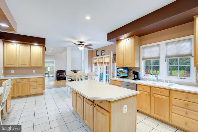 a kitchen with stainless steel appliances a refrigerator sink and stove